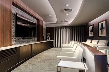 Private media room featuring surround-sound and stadium seating*